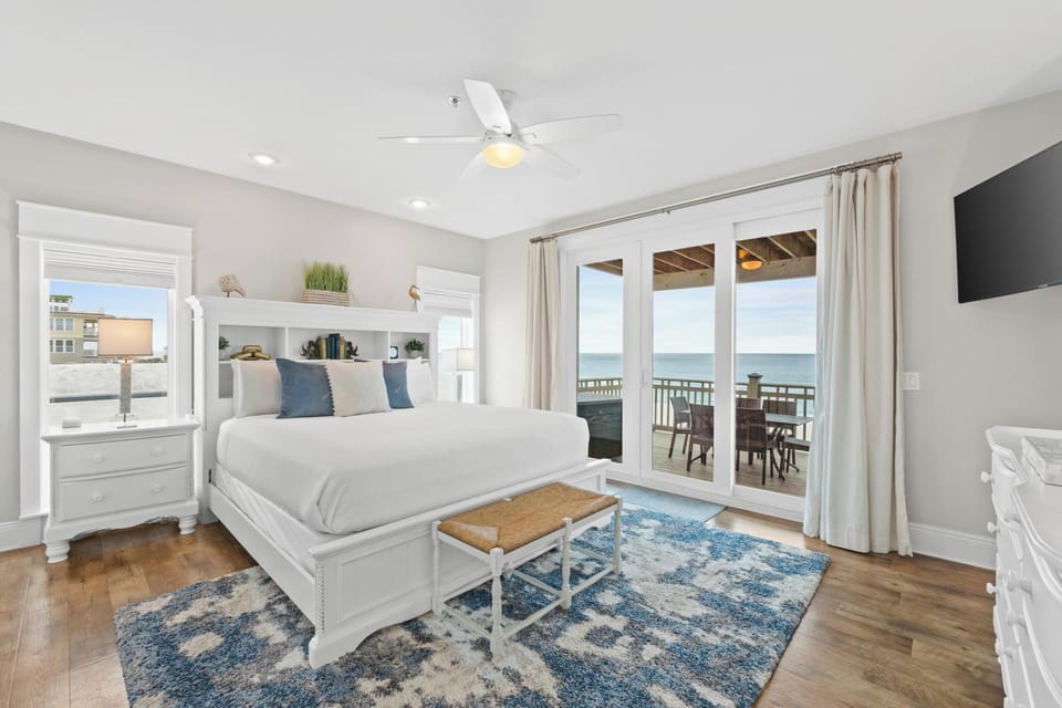 King suite with balcony access—wake up to waves, drift off to sunsets