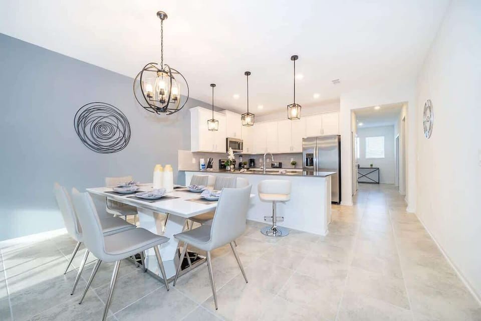 Dining table fully set with utensils and dinnerware — designed for family dining near Orlando.