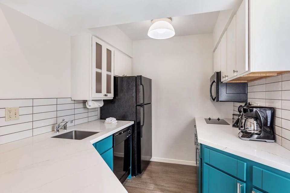 Brew morning coffee and prep snacks with full appliances.