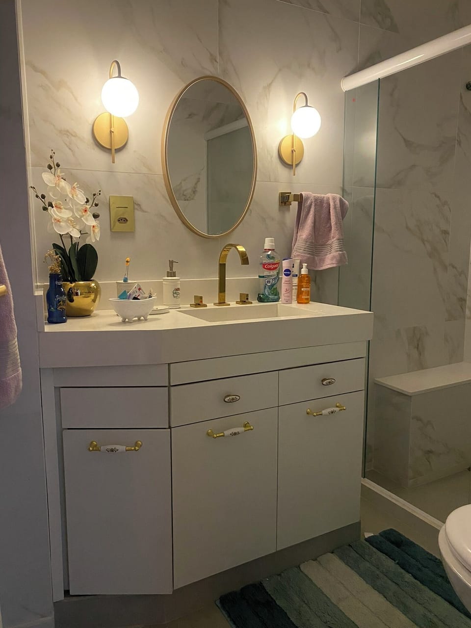 Bathroom Vanity and Sink with walk in shower.
