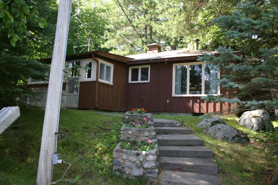 FRONT OF COTTAGE AS VIEWED FROM THE LAKE