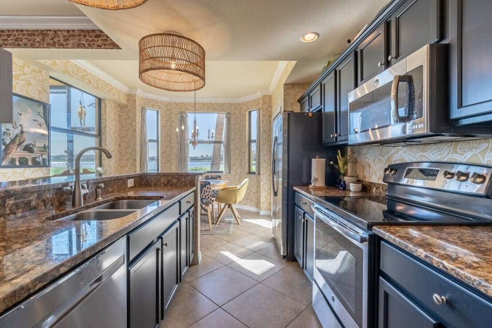 Fully equipped kitchen with modern appliances and everything you need to cook and dine in, including cookware, dishes, and utensils. Perfect for preparing meals at home!