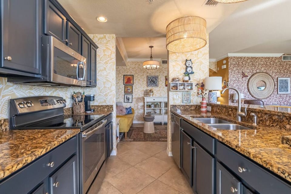 Fully equipped kitchen with modern appliances and everything you need to cook and dine in, including cookware, dishes, and utensils. Perfect for preparing meals at home!