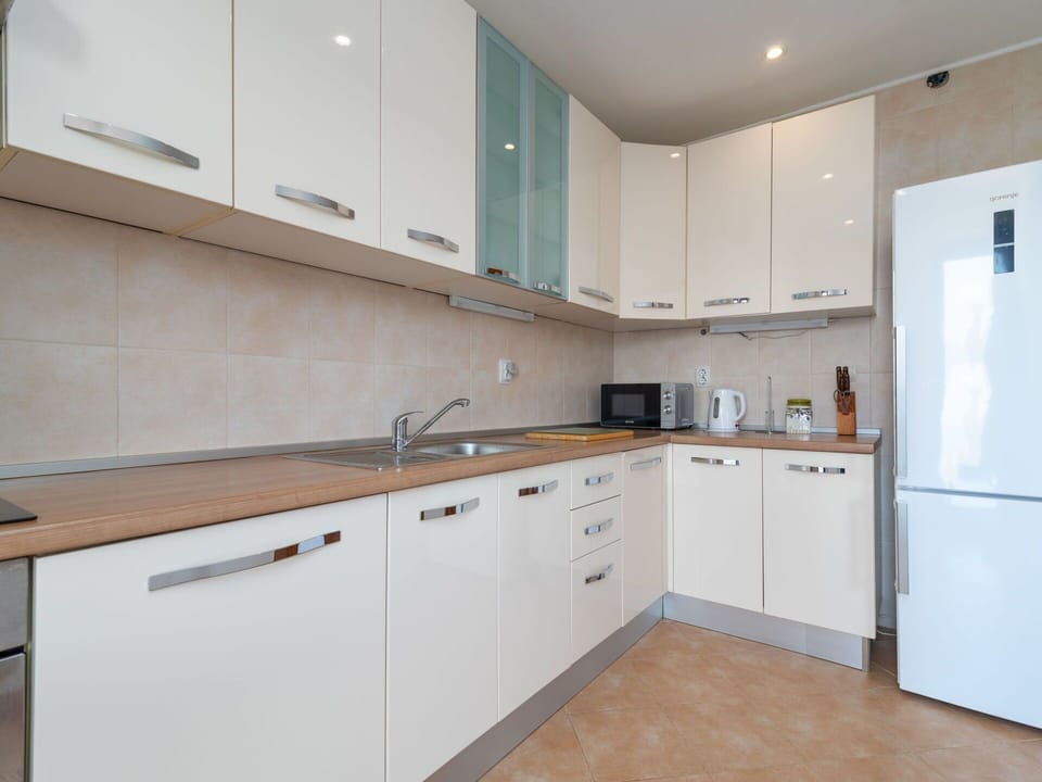 Kitchen, Countertop, Cabinetry, Kitchen Appliance, Flooring, Major Appliance, Wood, Interior Design, Floor, Sink