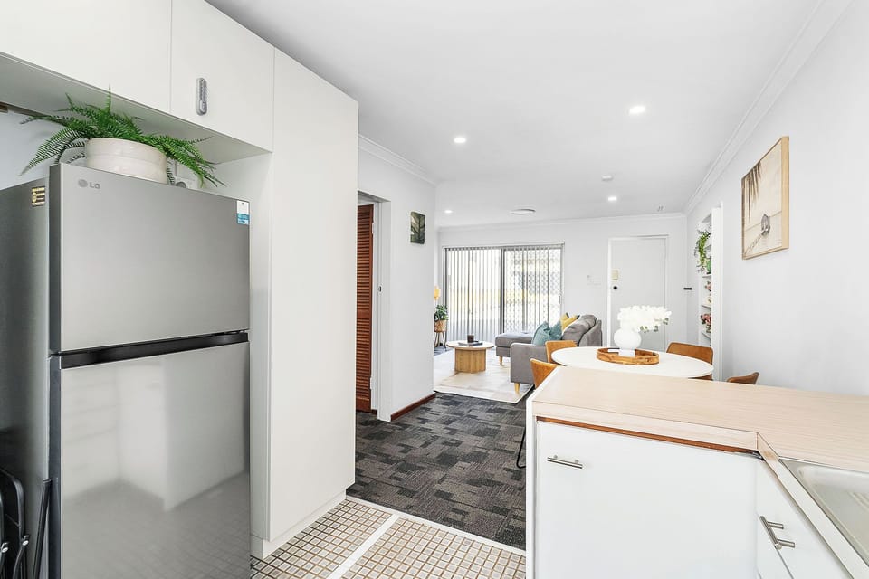 Experience our bright, open-plan living area, designed for seamless flow between the kitchen, dining, and lounge—the perfect home base for your getaway.