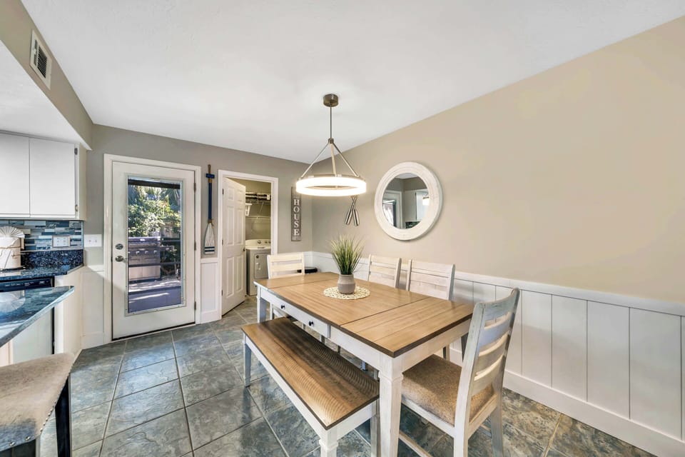 There is a dining table, perfect for enjoying a meal or playing a game.