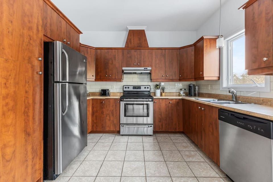 Spacious kitchen with stainless steel appliances and plenty of counter space.