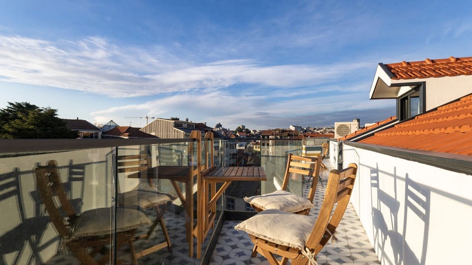 Start your day with a coffee or unwind with a glass of wine at sunset on this charming balcony, overlooking the stunning city of Porto. 
#PortoViews #AlfrescoLiving #StayInStyle