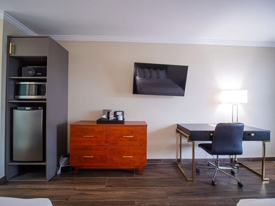 Settle in with convenient in-room fridge, microwave, and desk.