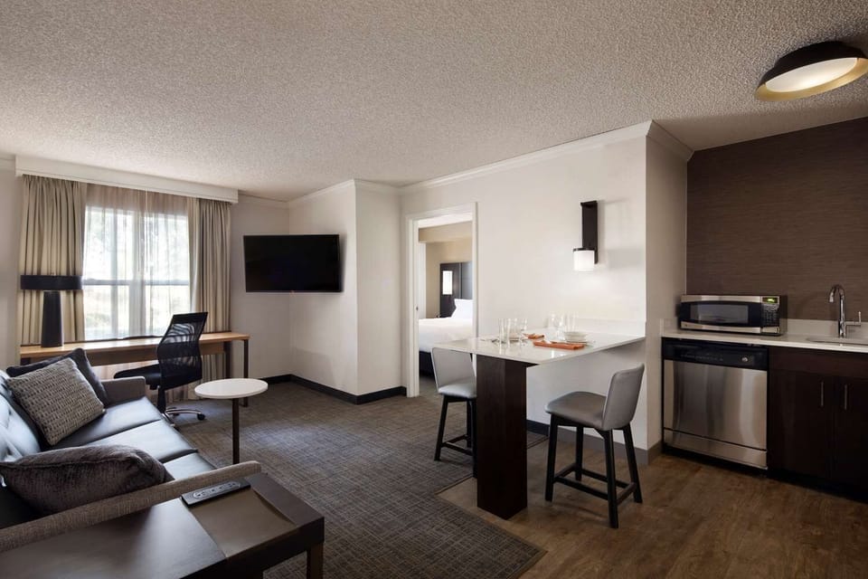 Work comfortably, then relax in your open, modern suite.