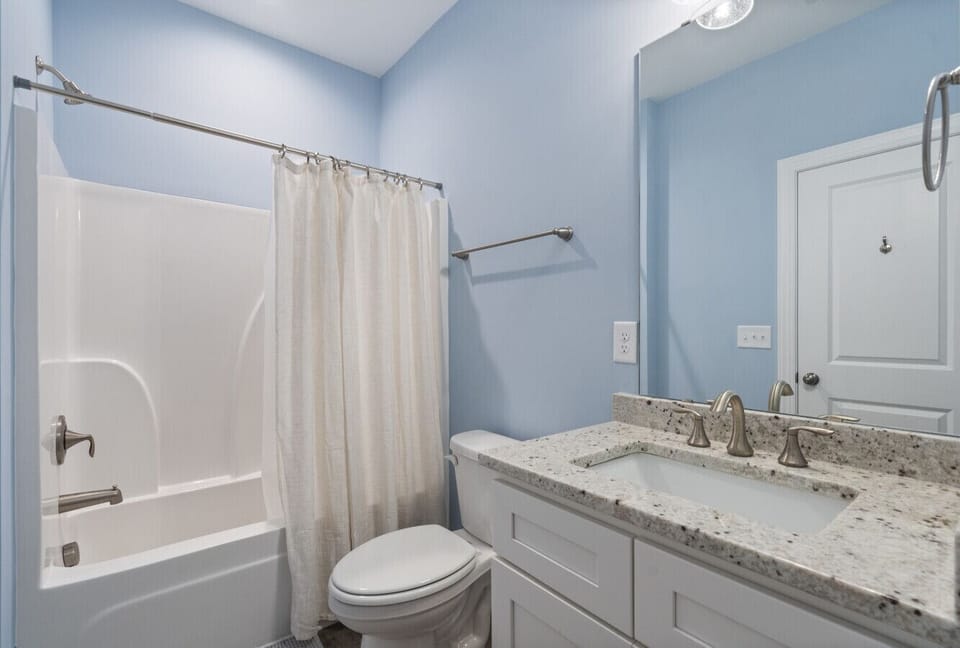 Guest bathroom with tub and shower