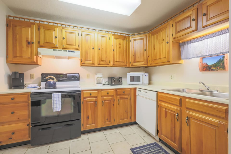 Kitchen has full size appliances, dishware, flatware, glassware, cooking utensils and pots & pans.