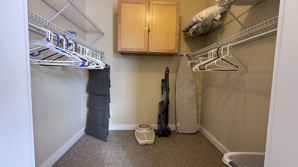 Walk-in closet to the Primary Bedroom