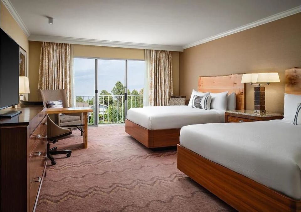 Wake up refreshed with balcony views and plush beds.