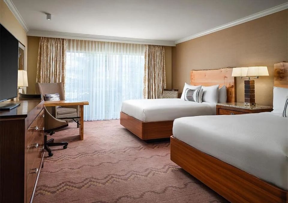 Settle in comfortably with two beds and a dedicated desk.