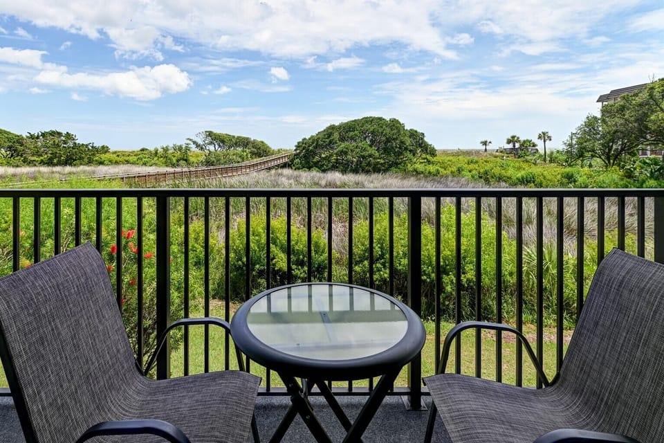 Enjoy beautiful views of the dunes and ocean beyond right from the balcony.