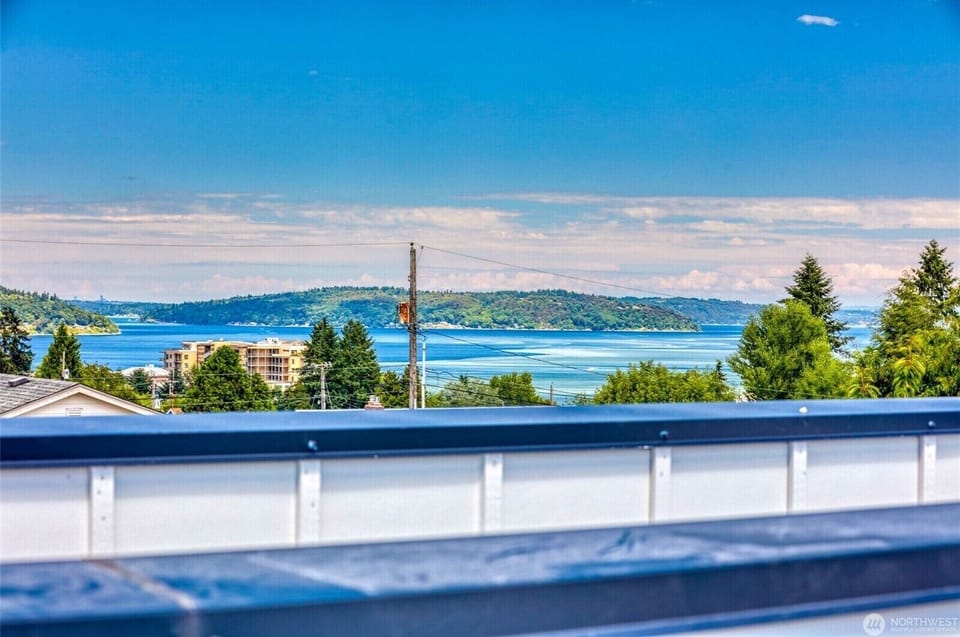 Breathtaking views from the private rooftop deck overlooking the Puget Sound.