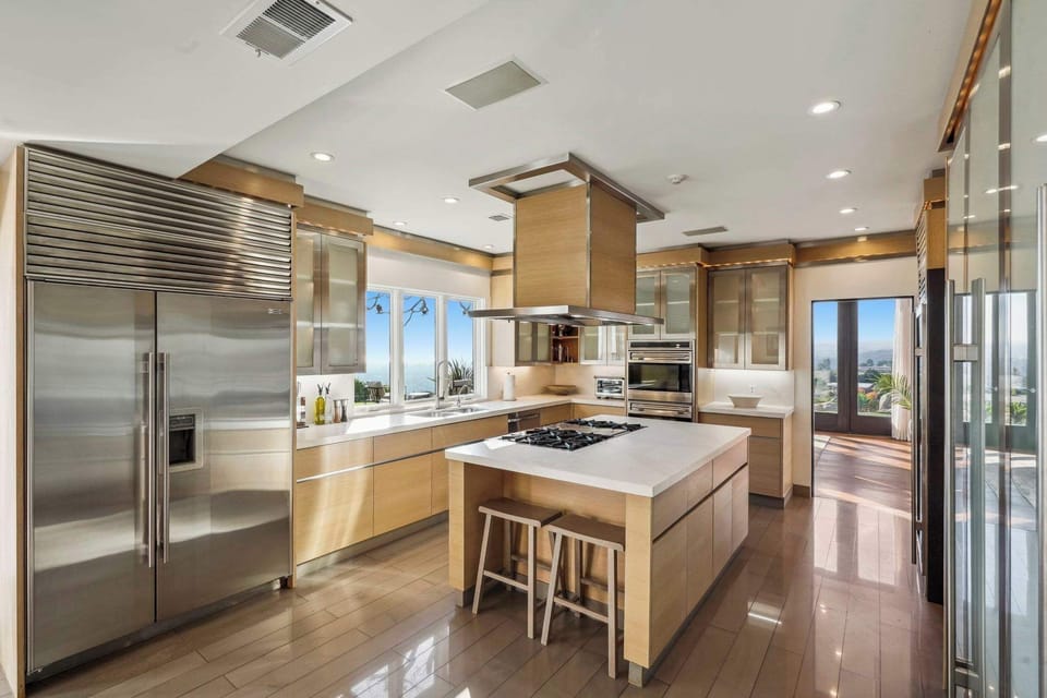 Enjoy the beauty of sleek cabinetry and polished stone countertops.