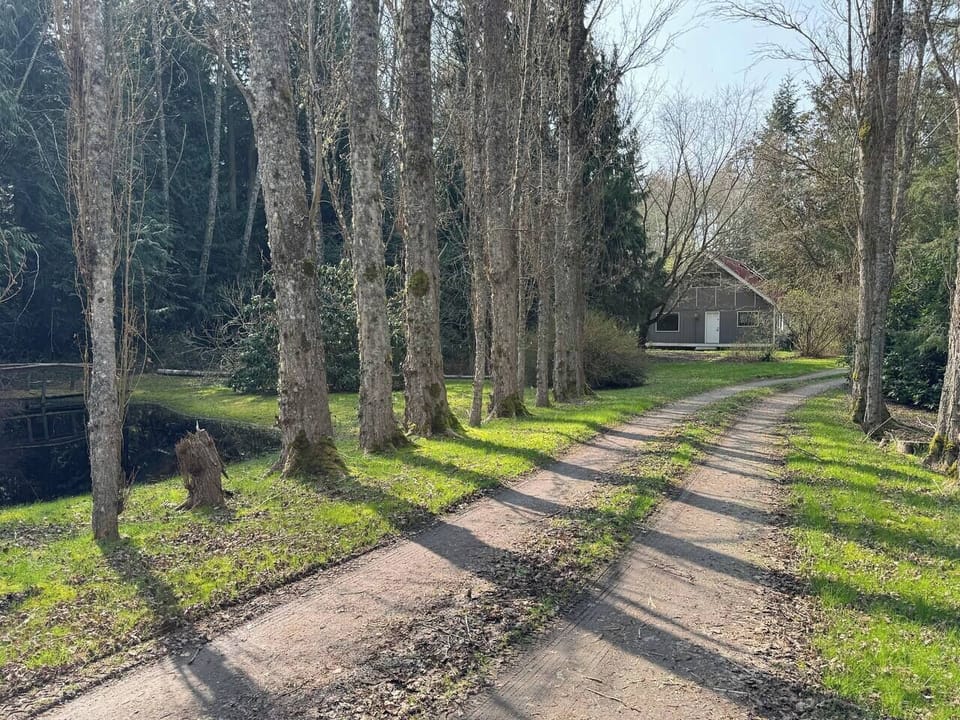 The perfect country setting on the island - a long poplar lined drive leads by a little seasonal pond to the secluded house set well back on the 2.5 acres.