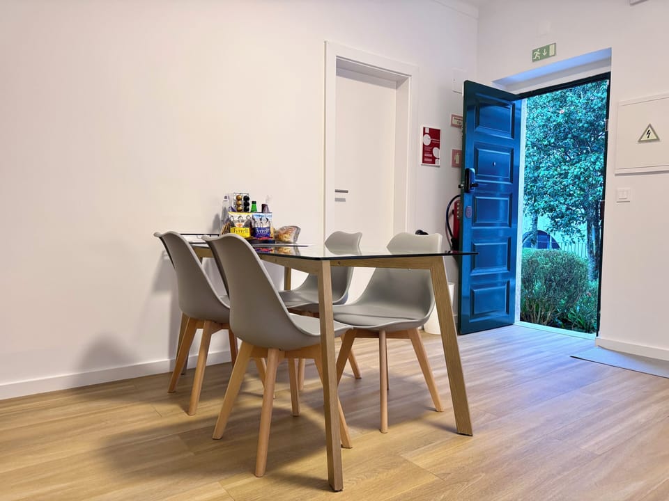 Sunny dining area overlooking the garden, perfect for meals or remote work