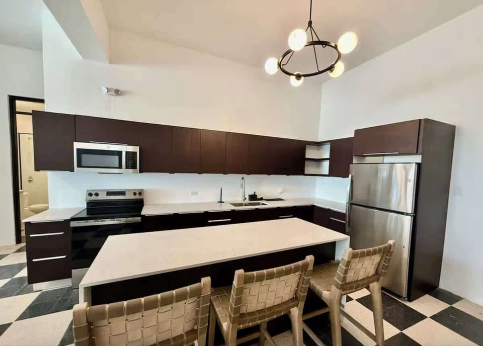 Spacious kitchen with island seating for casual meals and conversation.