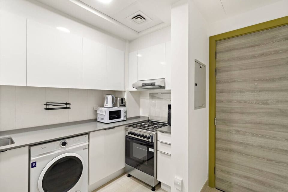 Kitchen: Whip up culinary delights in this sleek, fully-equipped kitchen with modern appliances!
