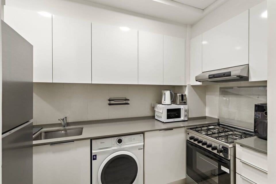 Modern Kitchen: Sleek appliances and ample counter space for culinary adventures in Dubai!