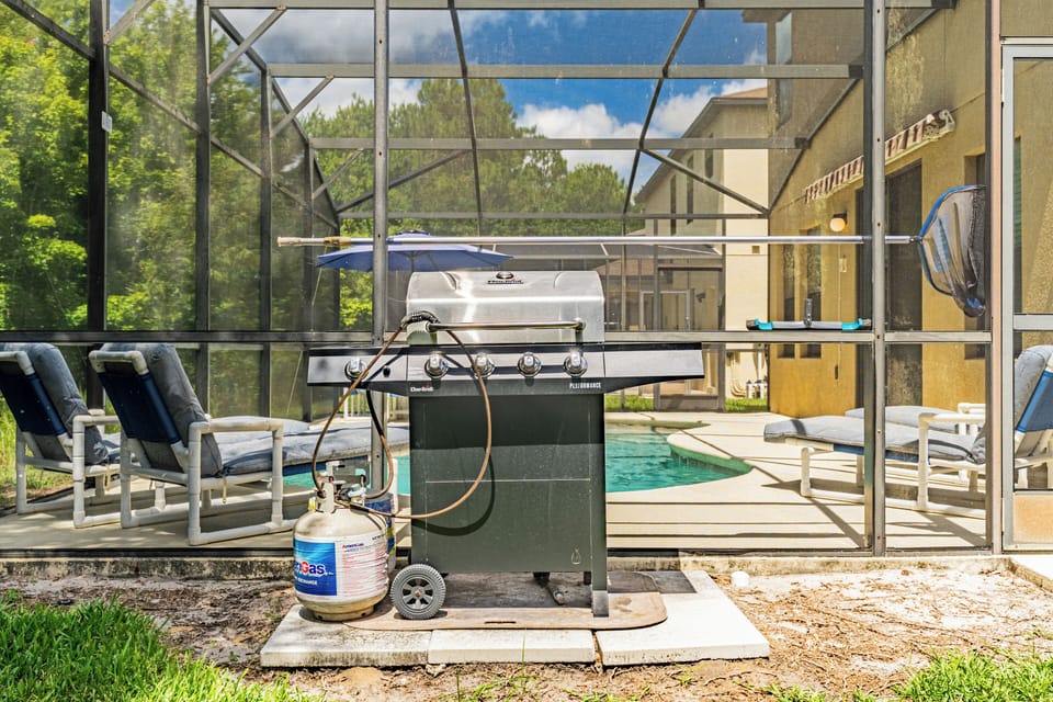Enjoy a fun family BBQ by the pool, perfect for dining and making memories.