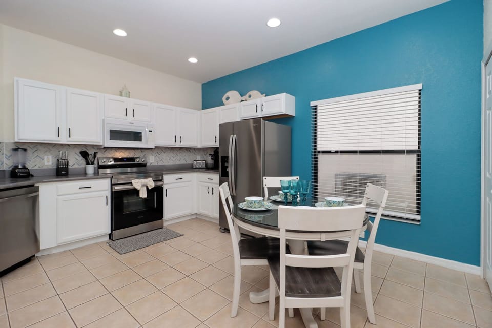 Step into this open-concept kitchen, designed for both functionality and style. The spacious layout features modern appliances and ample counter space.