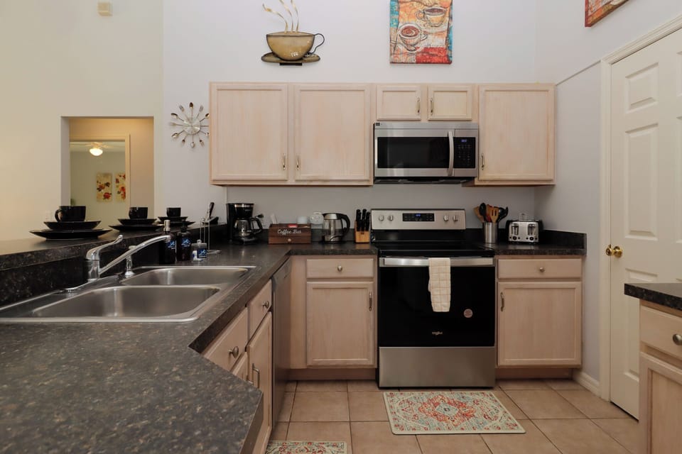Featuring state-of-the-art appliances, expansive countertops, and plenty of storage, this kitchen is perfect for preparing anything from a casual breakfast to a gourmet dinner.