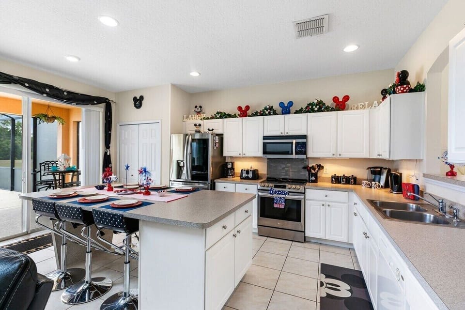 Large updated kitchen with stainless steel appliances