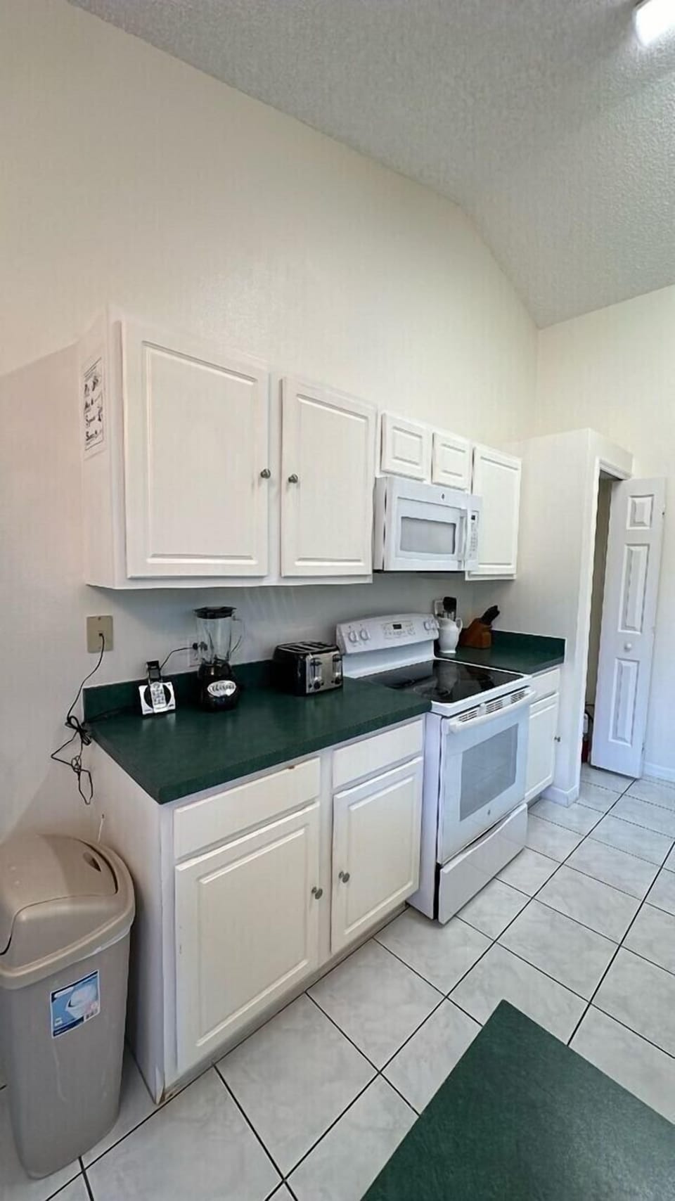 An updated open kitchen that oversees the pool and hot spa is the ultimate blend of modern design and luxurious living.