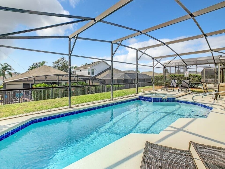 Enjoy your private oasis in this screened-in pool and spa area—perfect for sunny days and relaxing nights. Just minutes from Walt Disney World and Orlando's top attractions, this backyard escape offers comfort, privacy, and year-round sunshine.
