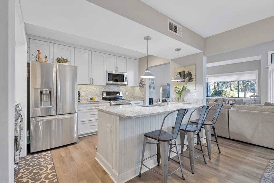 The villa is equipped with a fully stocked kitchen, washer, and dryer, ensuring a hassle-free stay.