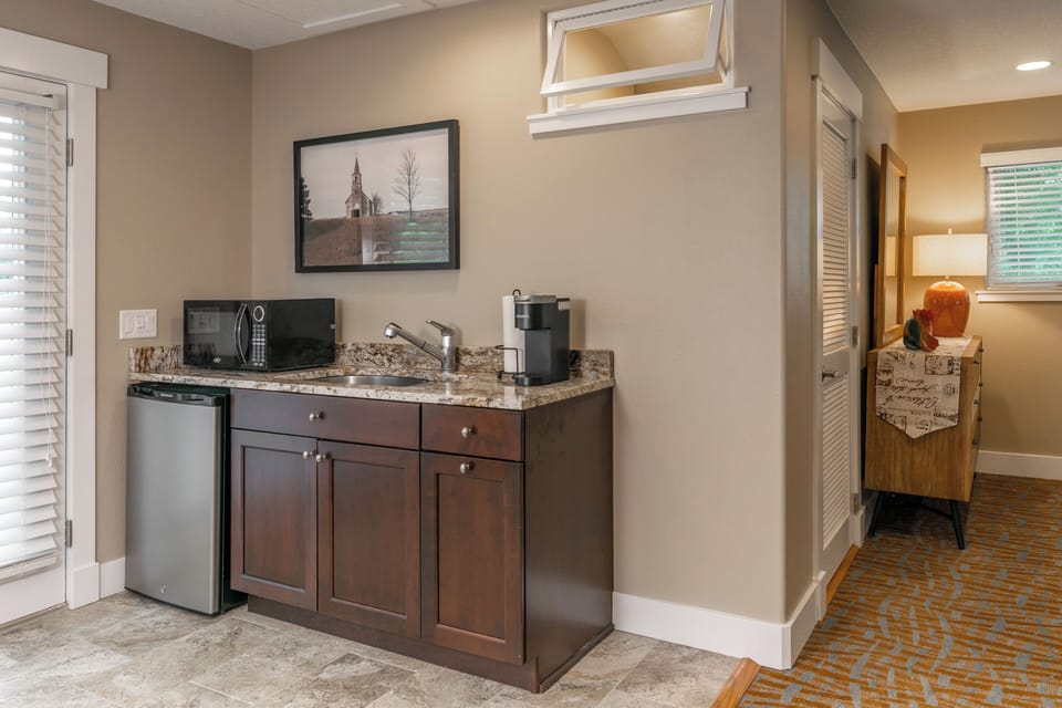 Coffee bar fully stocked with Kcups, cream and sugar. 