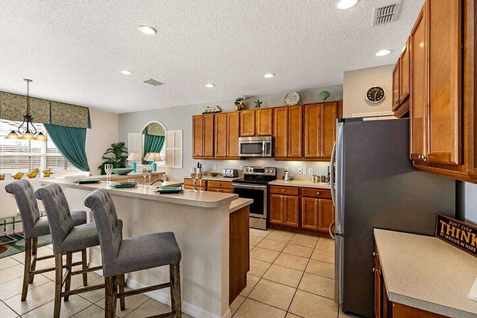 The kitchen features modern appliances and sleek countertops, creating a clean and contemporary look.