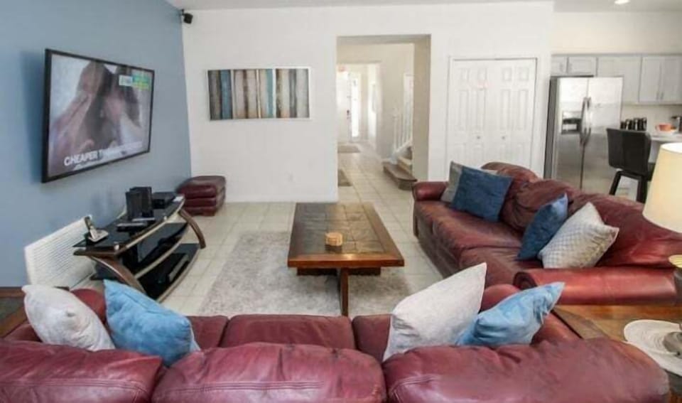 Open-plan living space with views of the sunny pool area.