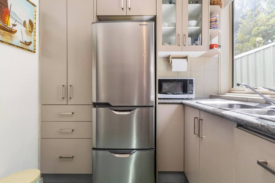 Whip up meals in the sunlit kitchen, complete with an oven, cooking essentials, and a French press for your morning brew.