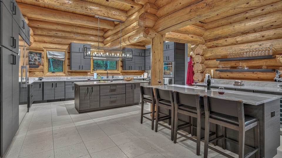 Kitchen, Main Level - Kitchen with modern appliances and island seating