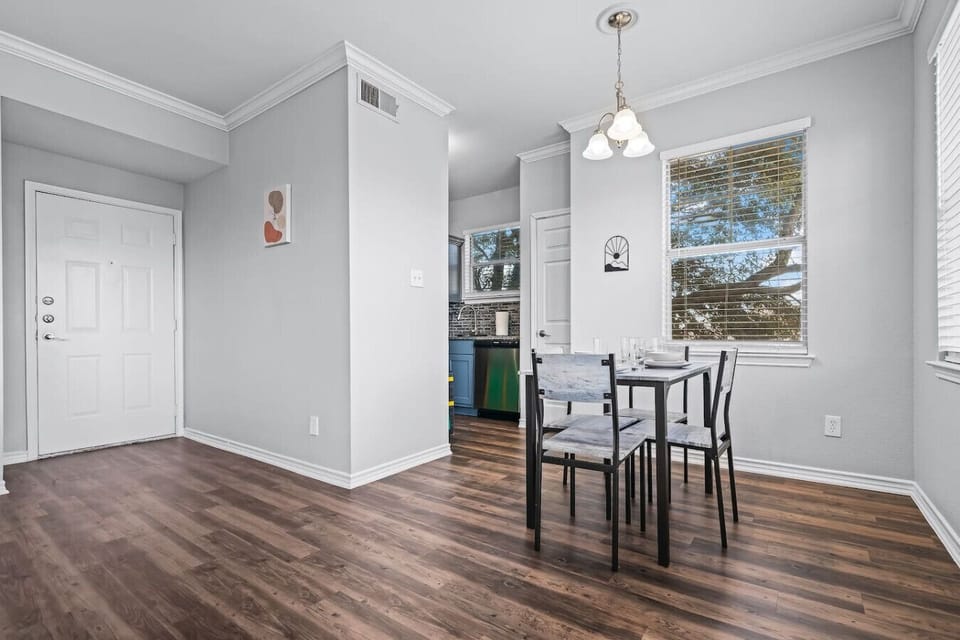 Set the table for memorable meals in this beautifully arranged dining area. With elegant place settings and a charming centerpiece, it's perfect for hosting dinner parties or enjoying family dinners in a cozy and stylish atmosphere.