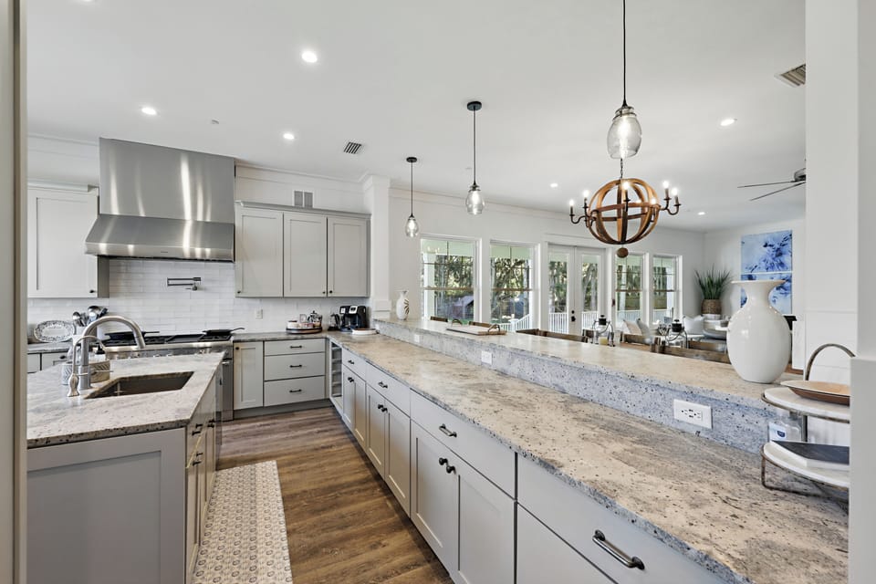Flow into the kitchen, sit at the granite bar while you watch what's cooking!
