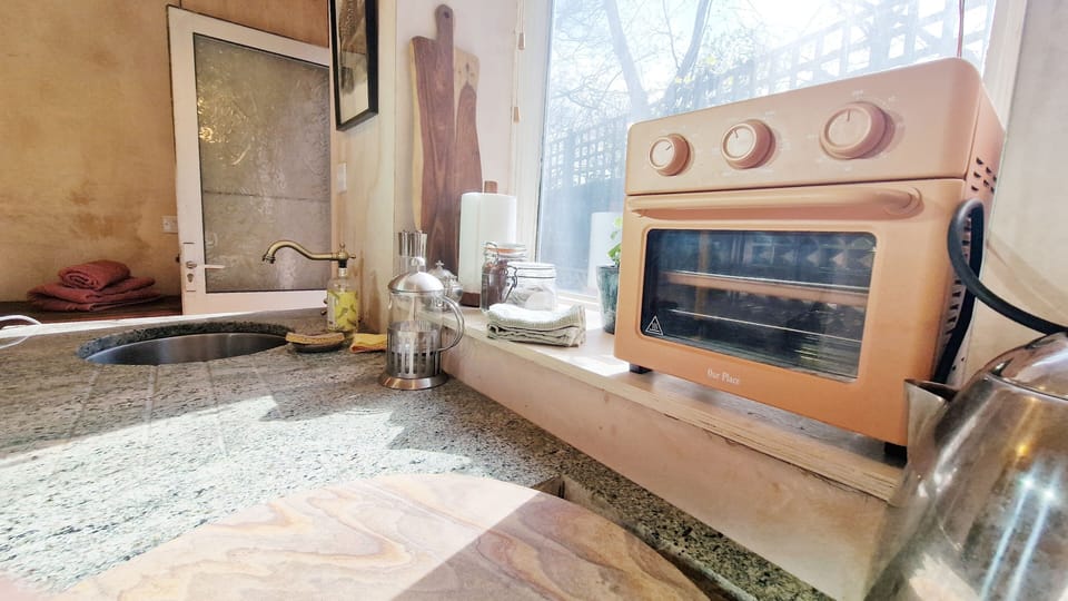 Our place oven which bakes and toasts. Also hot plate, coffee and tea making. 