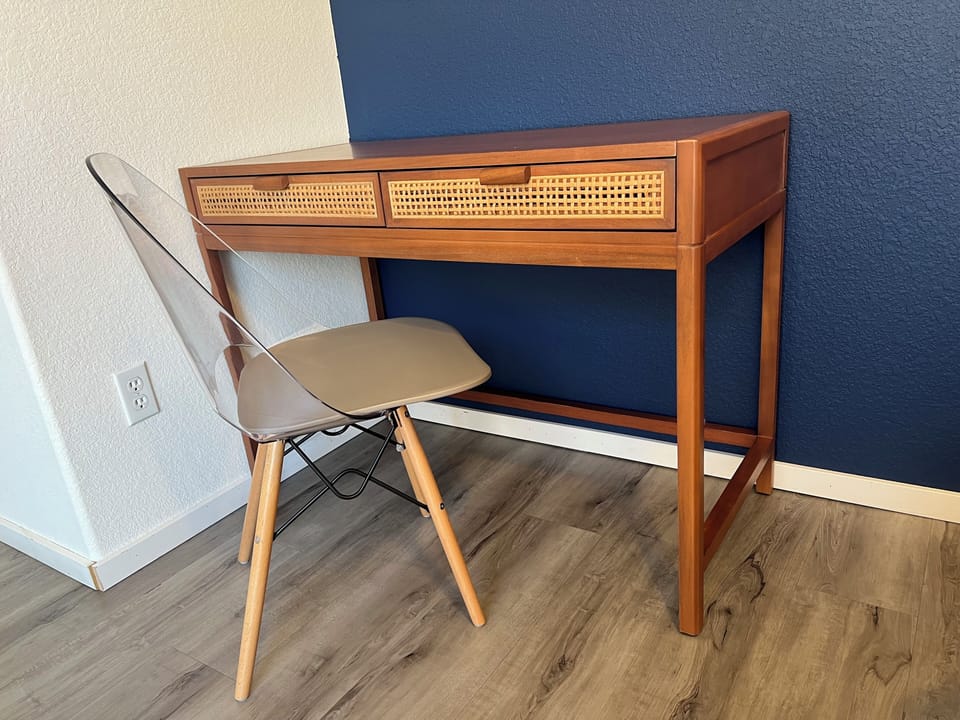Desk and chair setup for guests working comfortably while away from home.