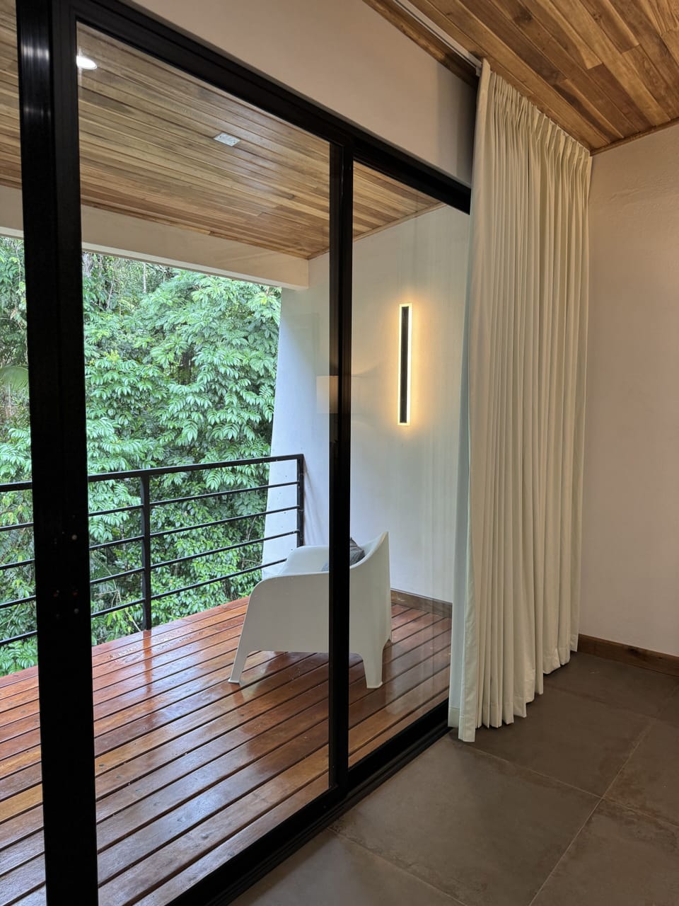 Black out curtains extend the width of all windows