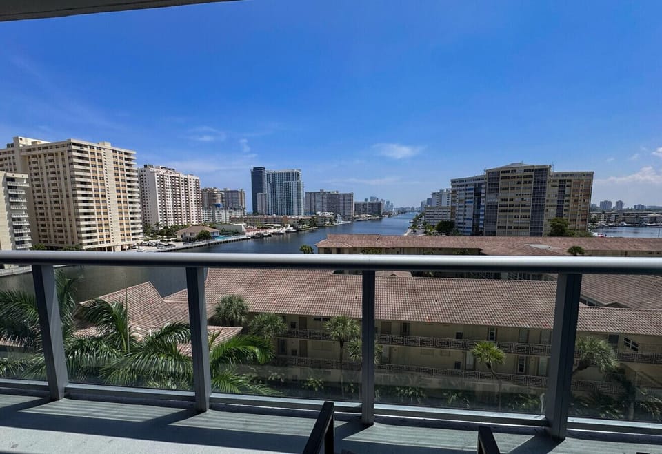 Private balcony with outdoor seating and skyline views.
