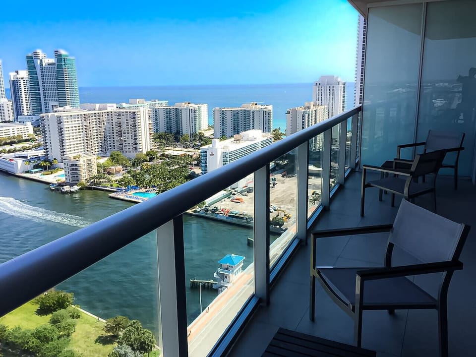 Private balcony with outdoor seating and skyline views.