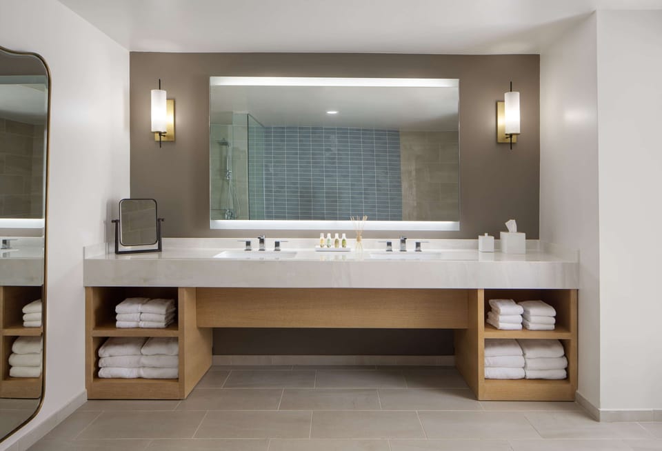 Refresh at the double vanity with spa-bright lighting.