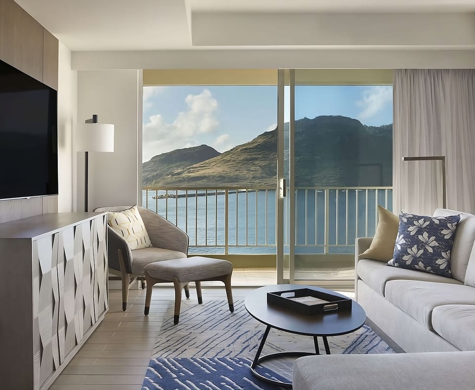 Wake up to soft daylight and serene water beyond.