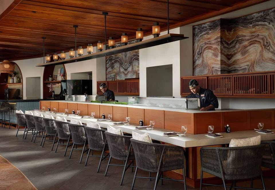 Linger over dinner at the elegant chef’s counter seating.