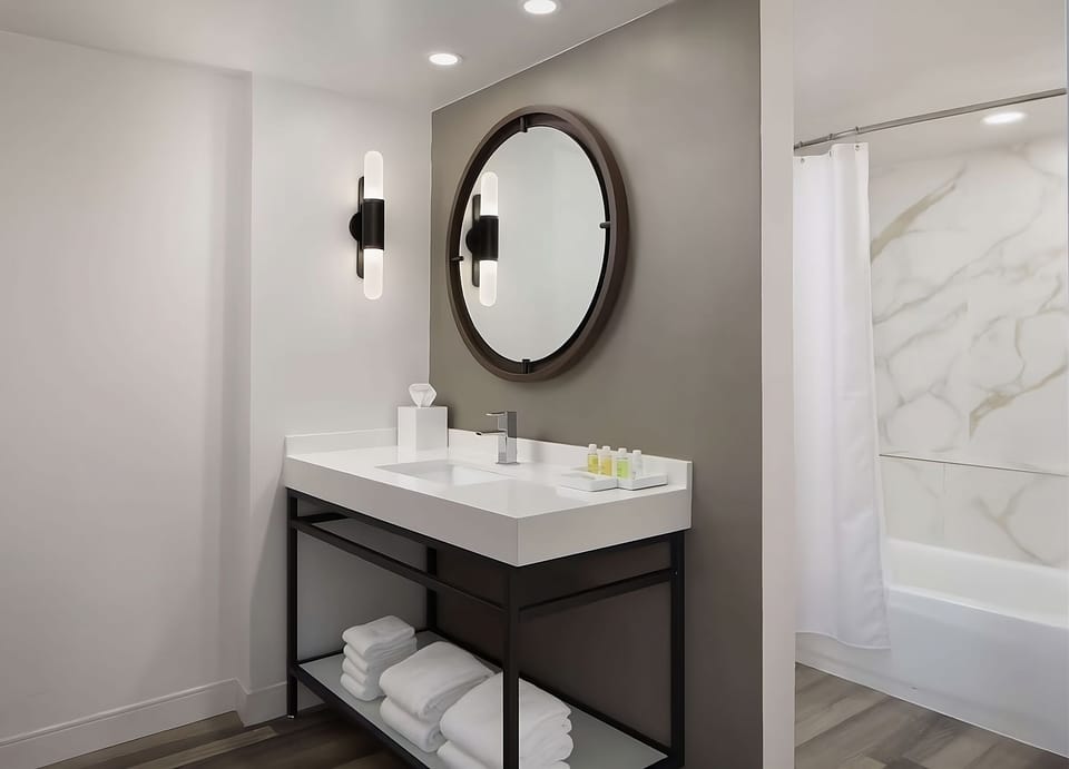 Start the day at a glowing vanity with fresh towels.